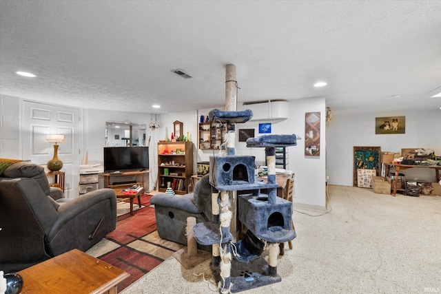 living room featuring visible vents, recessed lighting, and a textured ceiling