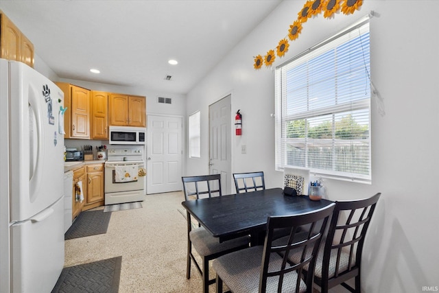 dining space featuring recessed lighting and visible vents