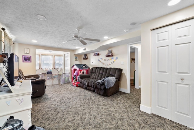living area with a textured ceiling, recessed lighting, carpet, and ceiling fan