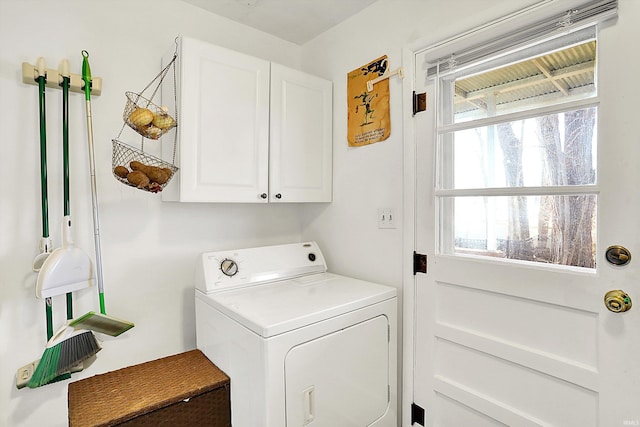 laundry area with plenty of natural light, cabinet space, and washer / dryer