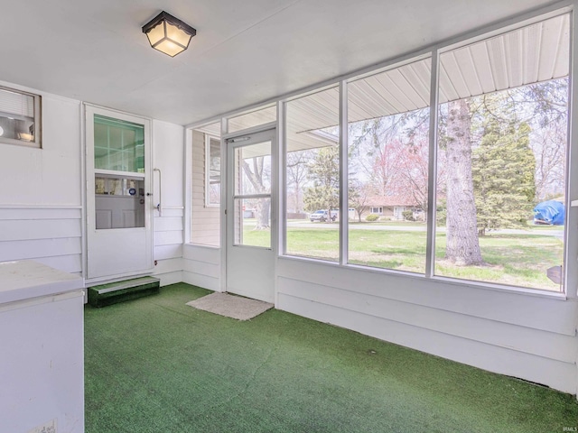 unfurnished sunroom with a wealth of natural light