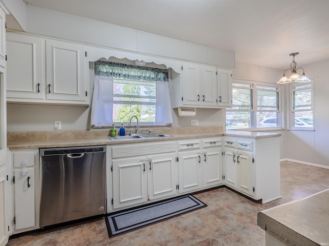 kitchen featuring white cabinets, dishwasher, light countertops, and a sink