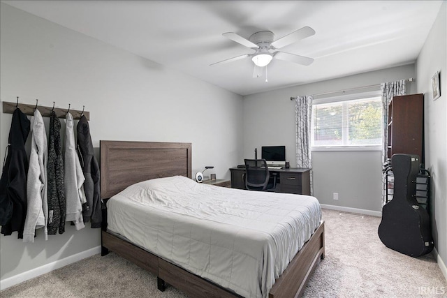bedroom with baseboards, carpet, and a ceiling fan