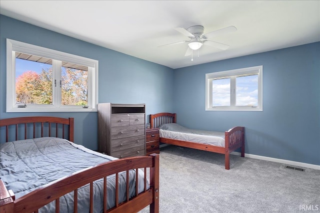 bedroom featuring baseboards, ceiling fan, and carpet floors
