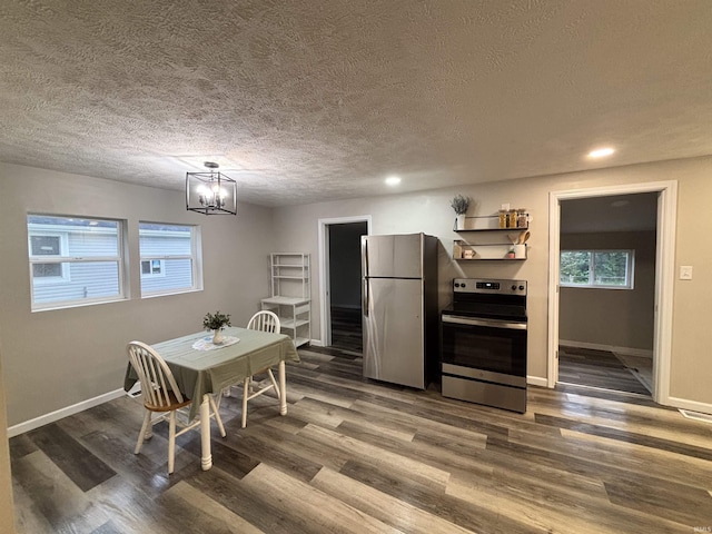 309 E S St, Eaton, IN 47338 - dining space with a textured ceiling, a chandelier, dark wood finished floors, recessed lighting, and baseboards