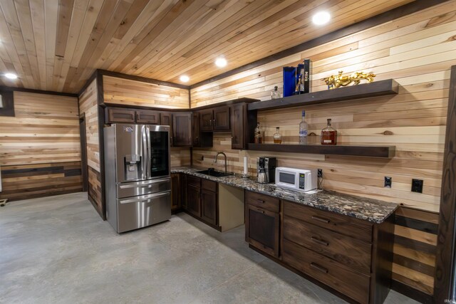2723 E Kammerer Rd, Kendallville, IN 46755 - kitchen featuring stainless steel fridge with ice dispenser, a sink, open shelves, and wooden walls