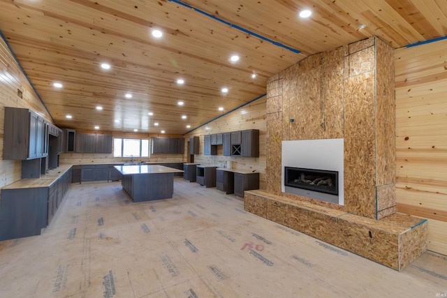 2723 E Kammerer Rd, Kendallville, IN 46755 - kitchen featuring recessed lighting, wooden ceiling, high vaulted ceiling, a sink, and a kitchen island