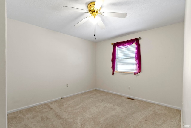 416 Maple St, Tipton, IN 46072 - empty room with baseboards, visible vents, ceiling fan, and carpet flooring