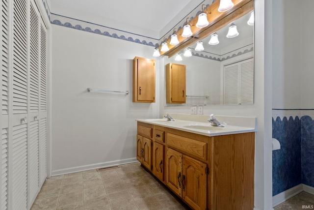 416 Maple St, Tipton, IN 46072 - full bathroom featuring a closet, double vanity, and a sink