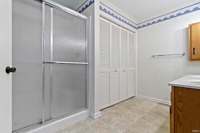 416 Maple St, Tipton, IN 46072 - bathroom with a shower stall, baseboards, and vanity