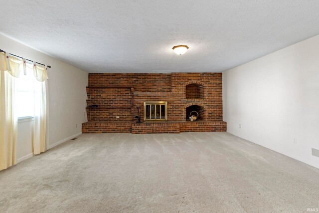 416 Maple St, Tipton, IN 46072 - unfurnished living room featuring carpet floors, a fireplace, and a textured ceiling