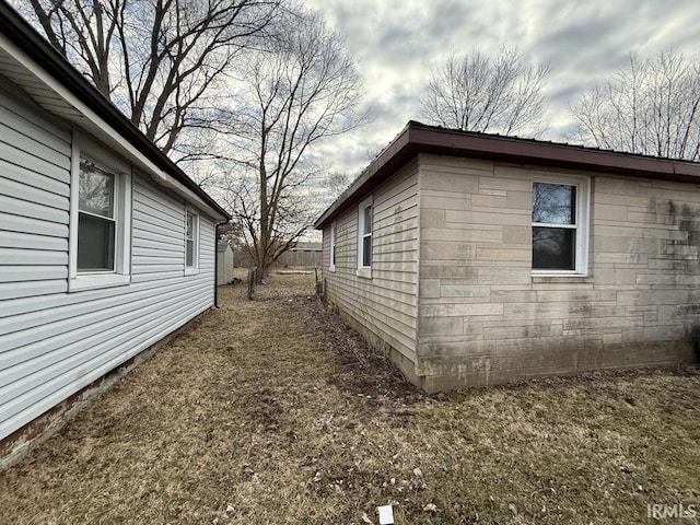 view of side of property with fence