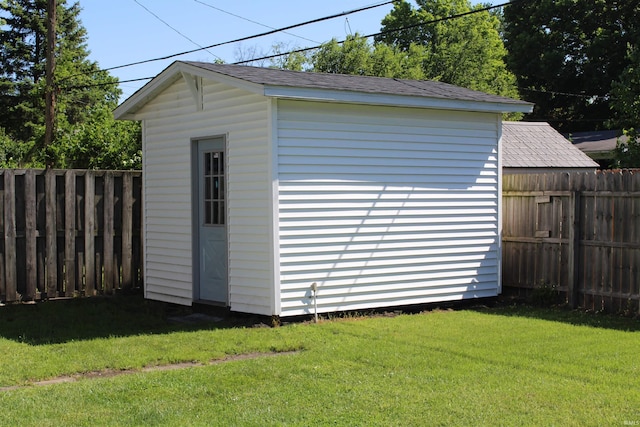 view of shed with a fenced backyard