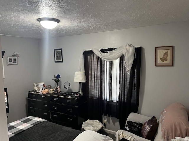 bedroom featuring a textured ceiling