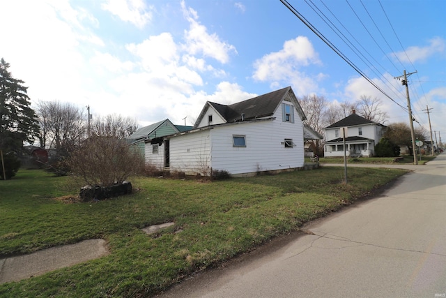 view of property exterior featuring a yard