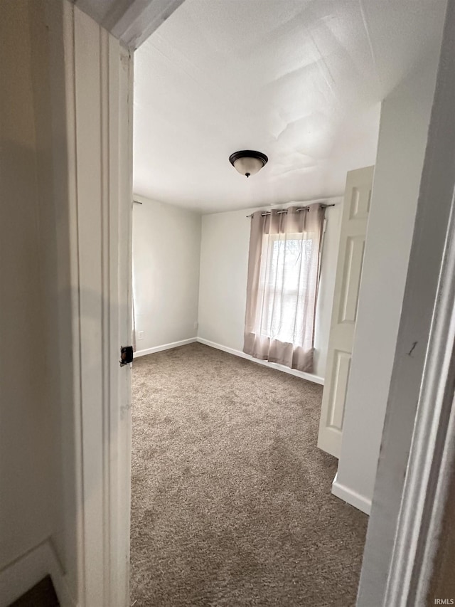 112 W Bond St, Attica, IN 47918 - unfurnished room with baseboards and dark colored carpet