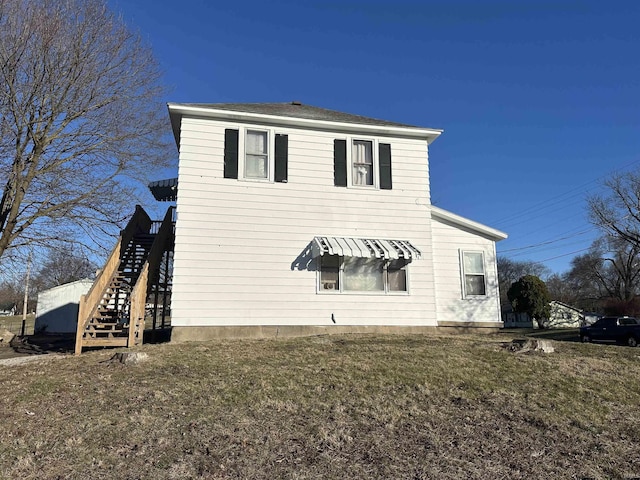112 W Bond St, Attica, IN 47918 - view of side of property featuring stairway and a yard