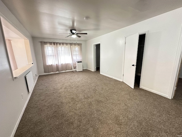 112 W Bond St, Attica, IN 47918 - unfurnished bedroom with baseboards, carpet, and a ceiling fan