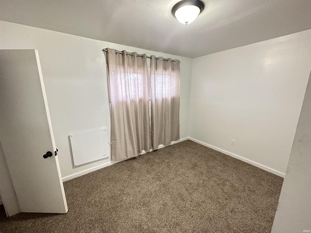112 W Bond St, Attica, IN 47918 - empty room with baseboards and carpet floors
