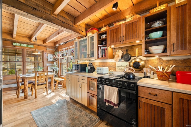 5175 Beanblossom Rd, Nashville, IN 47448 - kitchen featuring light countertops, stainless steel microwave, black range with electric cooktop, open shelves, and wooden ceiling