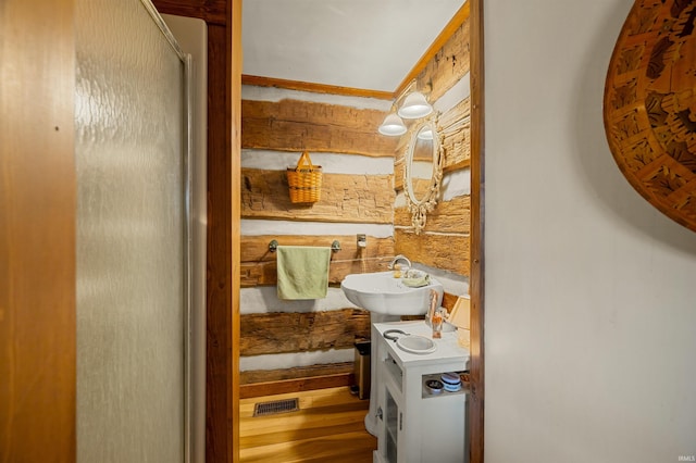 5175 Beanblossom Rd, Nashville, IN 47448 - bathroom with visible vents, a sink, and a shower with shower door