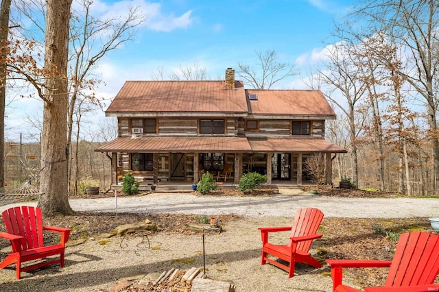 5175 Beanblossom Rd, Nashville, IN 47448 - rear view of property with a chimney, a porch, and metal roof