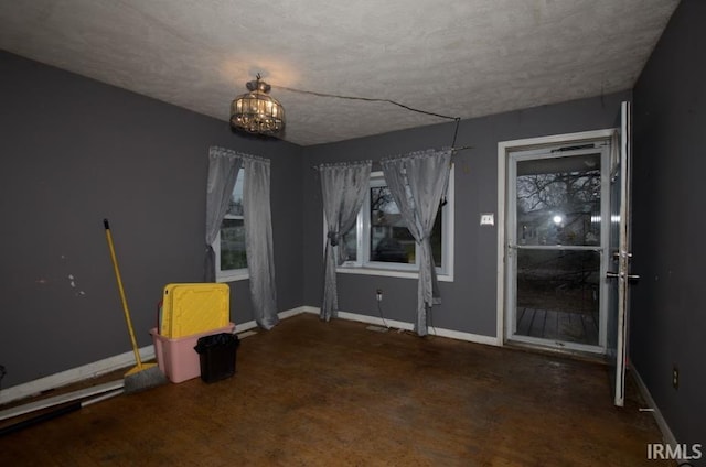 1620 Shelby Ave, Evansville, IN 47714 - interior space featuring baseboards, a notable chandelier, and a textured ceiling