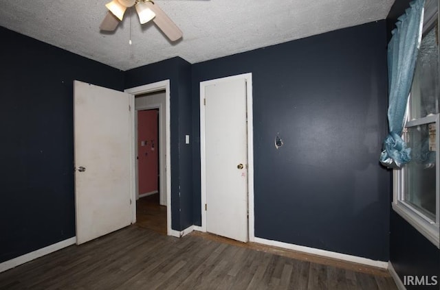 1620 Shelby Ave, Evansville, IN 47714 - unfurnished bedroom with a textured ceiling, baseboards, and wood finished floors
