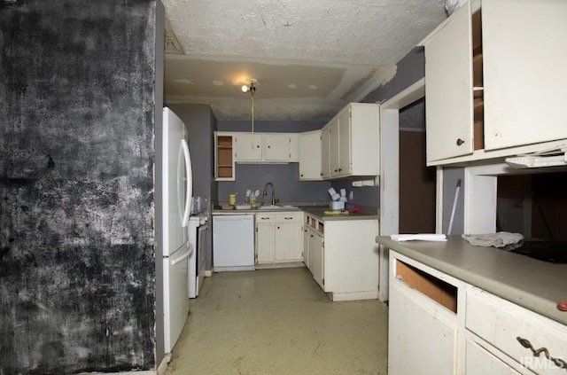 1620 Shelby Ave, Evansville, IN 47714 - kitchen featuring white appliances, white cabinets, light countertops, and a sink