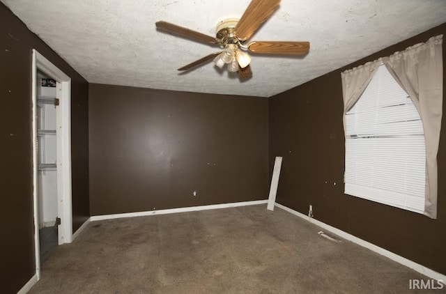 1620 Shelby Ave, Evansville, IN 47714 - unfurnished bedroom with baseboards, carpet floors, a textured ceiling, and a ceiling fan
