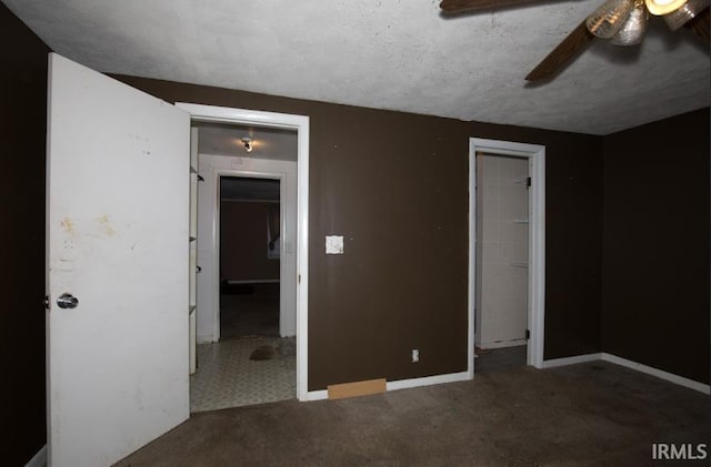 1620 Shelby Ave, Evansville, IN 47714 - unfurnished bedroom with a textured ceiling, carpet, baseboards, a ceiling fan, and a spacious closet