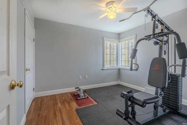 workout area with a ceiling fan, baseboards, and visible vents