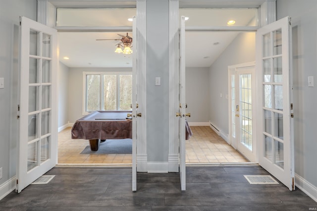 hall featuring visible vents, french doors, and wood finished floors