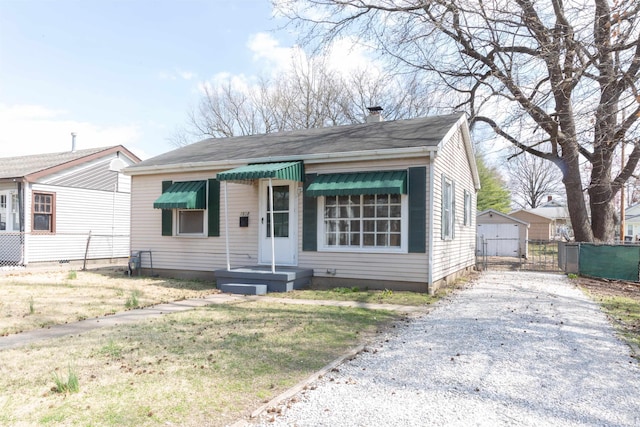 view of front of house with a gate and fence