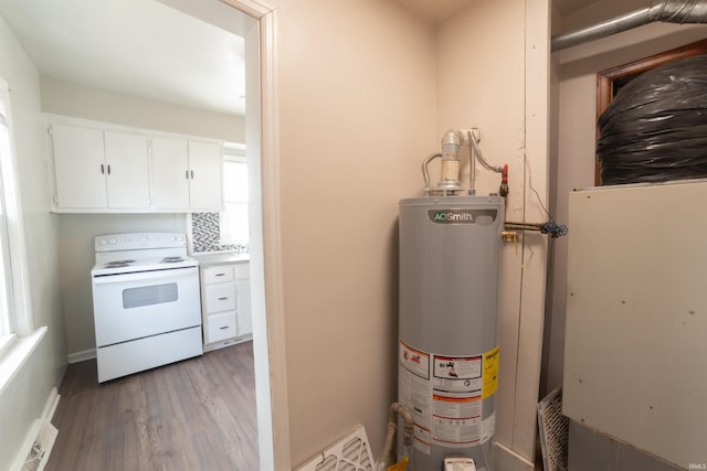 utility room featuring gas water heater