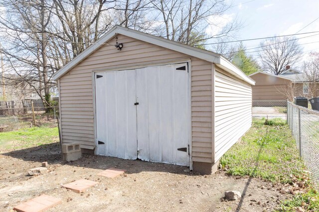 view of shed with fence