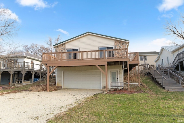 5540 N Willow Ave, Columbia City, IN 46725 - view of front of property with a front lawn, driveway, a garage, and stairway
