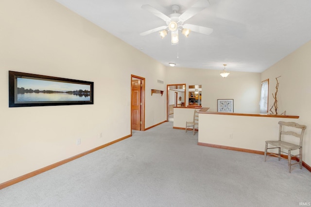 5540 N Willow Ave, Columbia City, IN 46725 - unfurnished room featuring baseboards, lofted ceiling, a ceiling fan, and light carpet