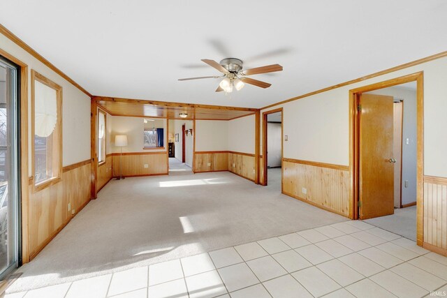 5540 N Willow Ave, Columbia City, IN 46725 - unfurnished room featuring ceiling fan, wood walls, and wainscoting