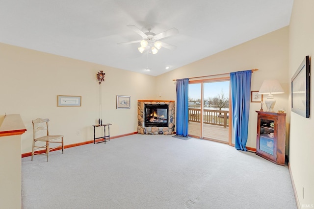 5540 N Willow Ave, Columbia City, IN 46725 - living area with carpet, baseboards, a fireplace, ceiling fan, and vaulted ceiling