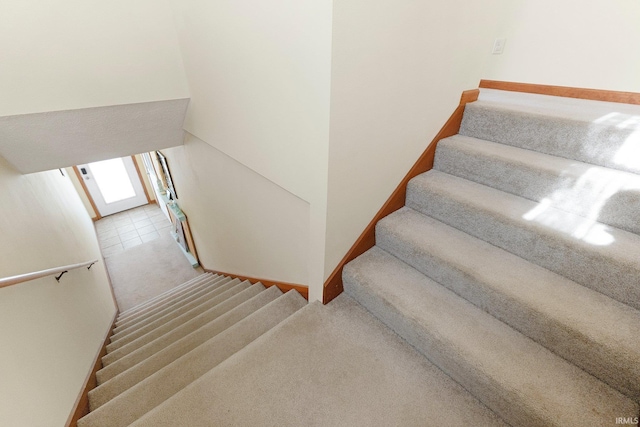 5540 N Willow Ave, Columbia City, IN 46725 - stairway featuring carpet flooring and tile patterned floors