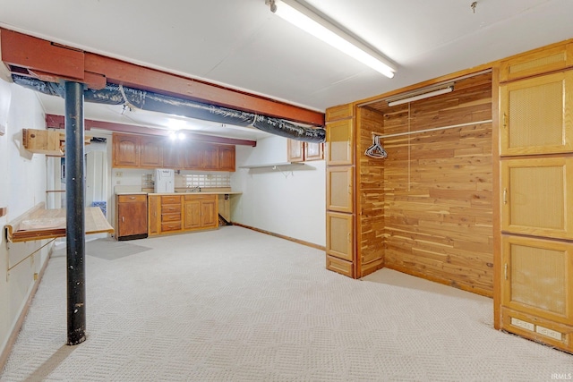 5540 N Willow Ave, Columbia City, IN 46725 - finished below grade area with light carpet, wood walls, and a sink