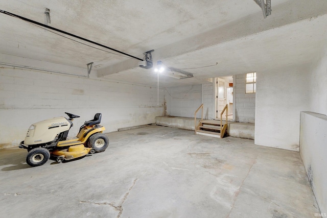 5540 N Willow Ave, Columbia City, IN 46725 - garage featuring concrete block wall and a garage door opener