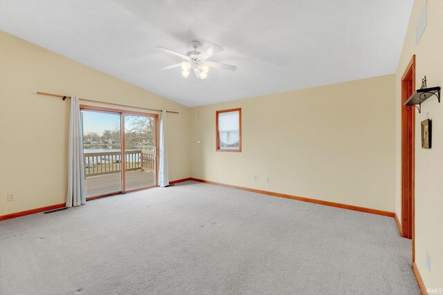 5540 N Willow Ave, Columbia City, IN 46725 - empty room featuring light carpet, baseboards, lofted ceiling, and ceiling fan