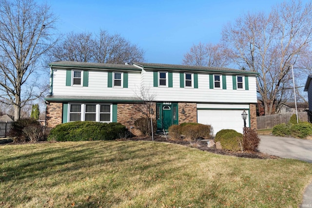 3323 Kiowa Ct, Fort Wayne, IN 46815 - view of front of property with fence, driveway, a front yard, brick siding, and a garage