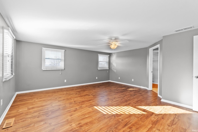 3323 Kiowa Ct, Fort Wayne, IN 46815 - unfurnished room featuring baseboards, visible vents, a ceiling fan, and wood finished floors