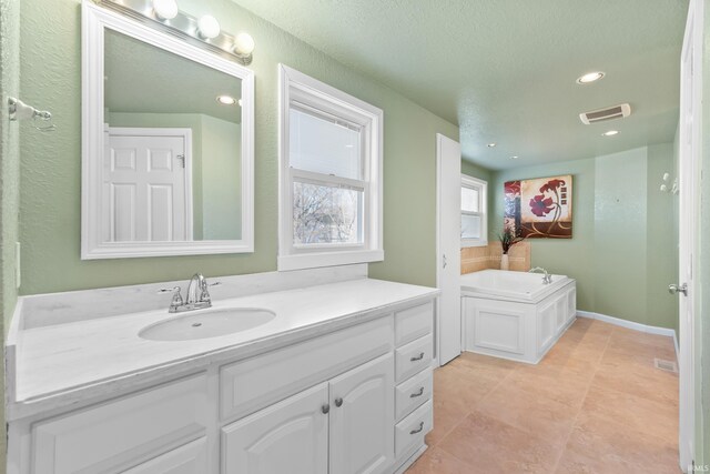 3323 Kiowa Ct, Fort Wayne, IN 46815 - bathroom with visible vents, recessed lighting, vanity, and a garden tub