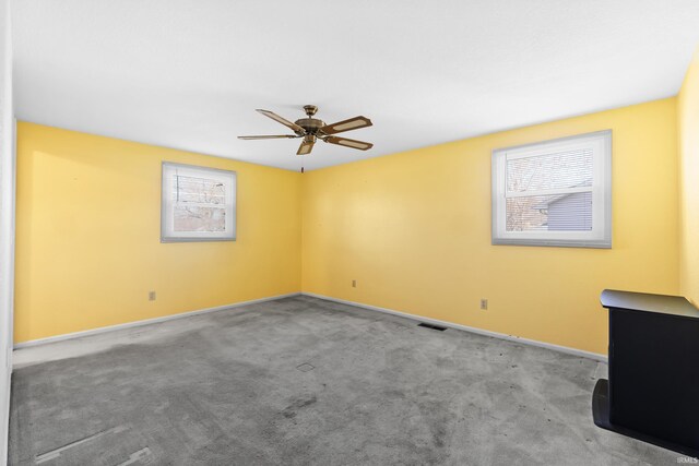 3323 Kiowa Ct, Fort Wayne, IN 46815 - empty room featuring carpet, baseboards, visible vents, and a ceiling fan
