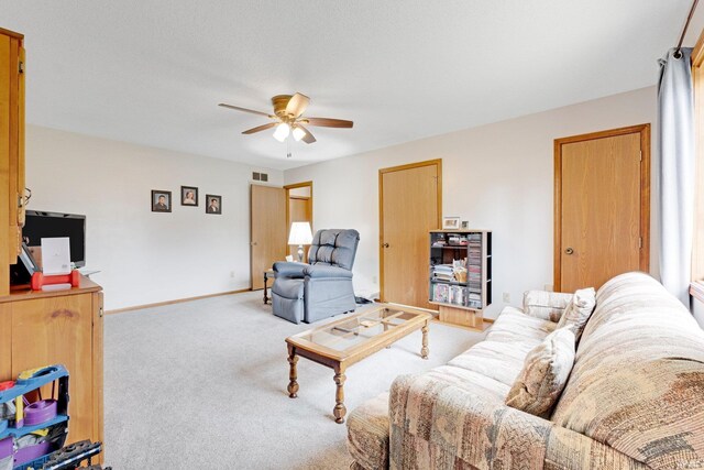 6027 Old Brook Dr, Fort Wayne, IN 46835 - carpeted living area with baseboards, visible vents, and ceiling fan