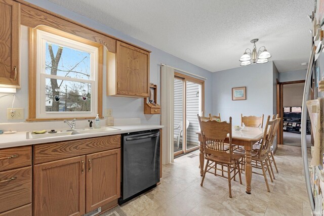 6027 Old Brook Dr, Fort Wayne, IN 46835 - kitchen featuring light countertops, a textured ceiling, a sink, dishwasher, and a notable chandelier